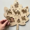 Puzzle forme feuille en bois - Les animaux de la forêt - le hibou tenu en main