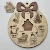 Puzzle en bois en forme de boule de noël - avec la pièce chalet sorti du puzzle