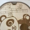 insert sensoriel en bois le panda avec son trou pour insérer balles, pompons ou autres